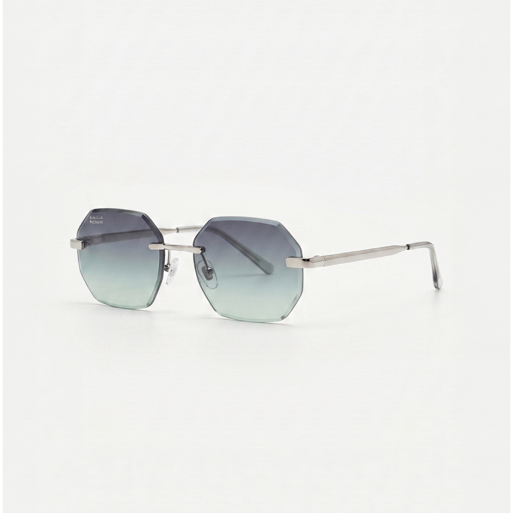 KOWN AETHER — rimless octagonal sunglasses with teal gradient lenses, three-quarter view