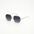 KOWN NOIR — rimless octagonal sunglasses with solid black lenses, three-quarter view